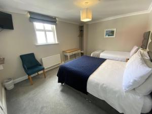 Ένα ή περισσότερα κρεβάτια σε δωμάτιο στο Murphy's Pub and Bed & Breakfast