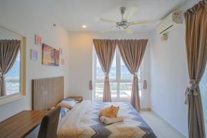 a bedroom with a bed with a dog laying on it at Mansion One l 4pax Studio A l Cityview l Gleneagle l by PerfectSweetHome in George Town
