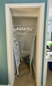 a closet with a bunch of hooks and a desk at Aquarium Exclusive Loft - Free Parking in Genova