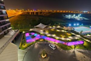 an overhead view of a building with lights at night at Grand Residence by NewInn in Basaksehir