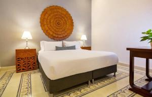 En eller flere senge i et værelse på L1-cm Loft Apartment In Getsemani With Air Conditioning Pool And WIFI