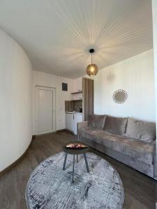 a living room with a couch and a table at Casa Gazi in Ulcinj