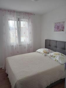 Postel nebo postele na pokoji v ubytování Nina