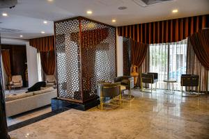 a lobby with a couch and a table and chairs at Dorana Hotel in Kyrenia +95 photos