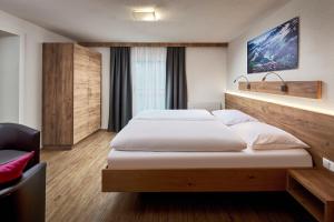 Voodi või voodid majutusasutuse Hotel Gasthof Siggen toas