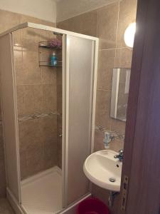 a bathroom with a shower and a sink at Viva Apartment in Sunny Beach