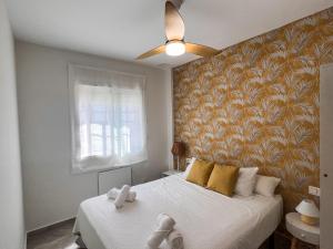 Postel nebo postele na pokoji v ubytování Tarifa Cozy House PALM BEACH