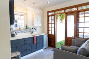 a kitchen with a sink and a counter at Mitre's Edge Orchard Suite in Klapmuts