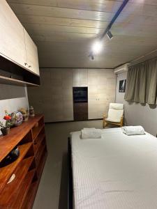 a room with a bed and a chair in it at Magic View 4U Luxury Villa, Tago Vibes in Kineta +30 photos