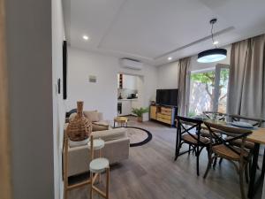a living room with a couch and a table at Seaside Murter Apartments in Murter