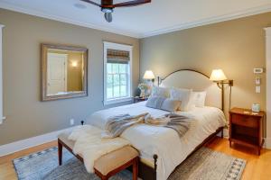 a bedroom with a large bed and a mirror at Stockbridge Retreat with Pool and Hot Tub! in Stockbridge +34 photos