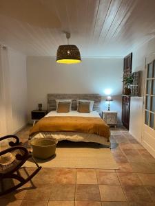 Letto o letti in una camera di Le vieux poirier à la Plaine des Cafres