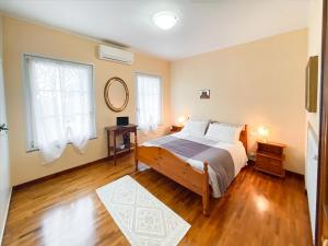 A bed or beds in a room at Exclusive Villa