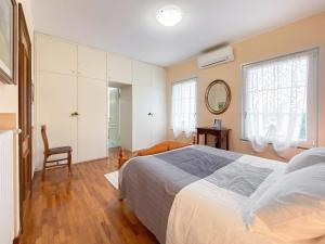 A bed or beds in a room at Exclusive Villa