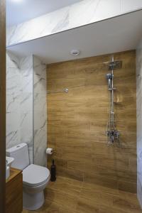 a bathroom with a toilet and a shower at Heaven Hill in Kazbegi