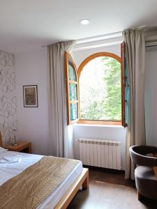 Postel nebo postele na pokoji v ubytování Garni Hotel Vila Drina