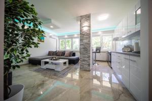 a living room with a couch and a table at Rayyan Apartment in Zagreb