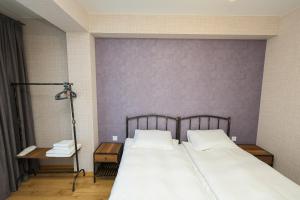 A bed or beds in a room at Heaven Hill