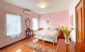 A bed or beds in a room at Exclusive Villa