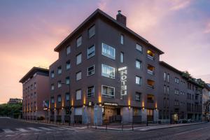 a large building with the word hotel on it at Hotel Crivi's in Milan