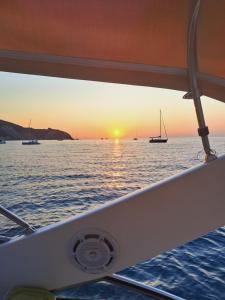 a view of the sunset from the front of a boat at Blaško apartment in Izola +9 photos