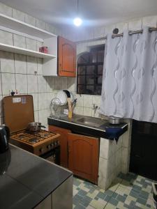 a kitchen with a sink and a stove at G&G Executive ONE bedroom Ngala Nakuru in Nakuru