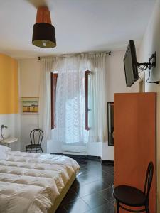 Säng eller sängar i ett rum på Affittacamere Sardegna Sole e Mare
