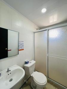 a bathroom with a toilet and a sink and a shower at Hostal islamar in San Andrés