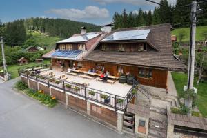 an aerial view of a house with solar panels on it at Penzion pod Pralesem in Velké Karlovice