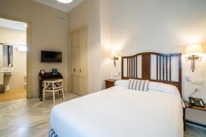 Postel nebo postele na pokoji v ubytování Hotel YIT Casa Grande