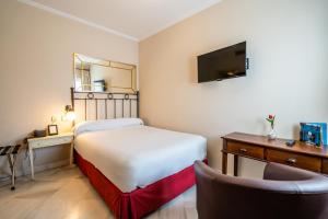 Postel nebo postele na pokoji v ubytování Hotel YIT Casa Grande