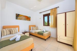 Posteľ alebo postele v izbe v ubytovaní Melfe Villas