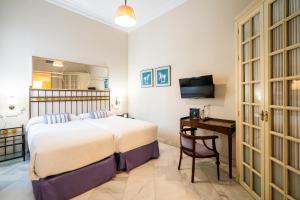 Postel nebo postele na pokoji v ubytování Hotel YIT Casa Grande