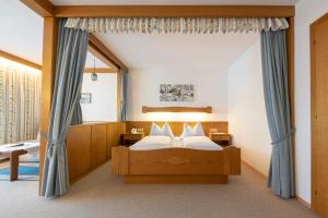 Ένα ή περισσότερα κρεβάτια σε δωμάτιο στο Frühstückspension-Appartementhaus Wasserer +89 φωτογραφίες