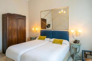 Postel nebo postele na pokoji v ubytování Hotel YIT Casa Grande