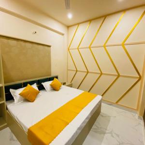 A bed or beds in a room at Golden Lotus Varanasi
