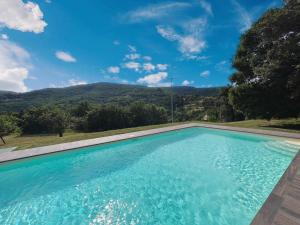 The swimming pool at or close to Podere San Cassiano