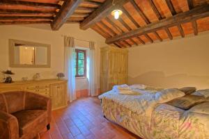 A bed or beds in a room at Podere San Cassiano