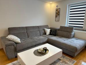 a living room with a couch and a coffee table at Centar in Krapina