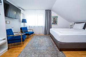 Postel nebo postele na pokoji v ubytování City Apartments FN L7 KLIMATISIERT-mit Küche