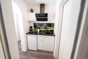 Kuchyň nebo kuchyňský kout v ubytování City Apartments FN L7 KLIMATISIERT-mit Küche + 20 fotografií