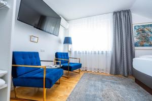 Postel nebo postele na pokoji v ubytování City Apartments FN L7 KLIMATISIERT-mit Küche