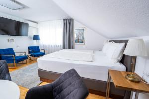 Postel nebo postele na pokoji v ubytování City Apartments FN L7 KLIMATISIERT-mit Küche