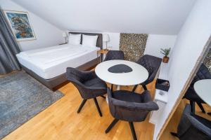 Postel nebo postele na pokoji v ubytování City Apartments FN L7 KLIMATISIERT-mit Küche