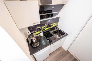 Kuchyň nebo kuchyňský kout v ubytování City Apartments FN L7 KLIMATISIERT-mit Küche