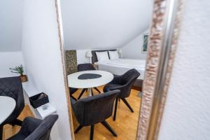 Posezení v ubytování City Apartments FN L7 KLIMATISIERT-mit Küche