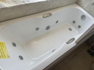 a white bath tub sitting on top of a counter at شقة مفروشة في القاهرة حي العجوزة على النيل in Cairo