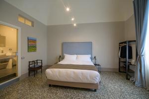 Posteľ alebo postele v izbe v ubytovaní Palazzo Sertorio Suites
