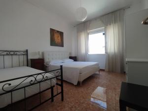 A bed or beds in a room at Brezza marina