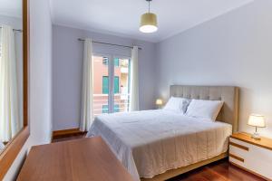 Ένα ή περισσότερα κρεβάτια σε δωμάτιο στο Ocean View Flat